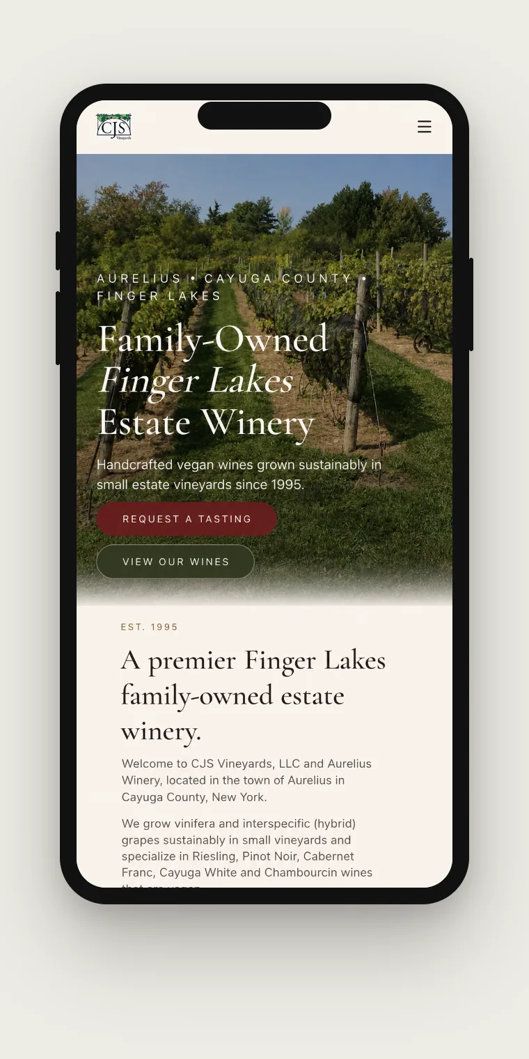 The redesigned CJS Vineyards home page shown on a mobile phone